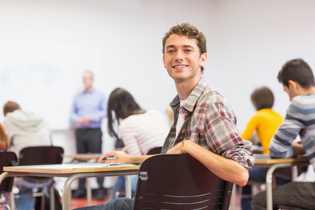 student turning back smiling in class